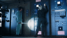 a man and a woman are standing in front of a wall with a sign that says " do not enter "