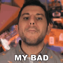 a man with a beard is making a funny face and says my bad