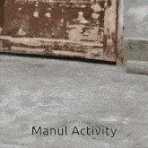 a sign that says manul activity is on a concrete surface