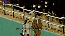 a man and a woman are standing next to each other on a sidewalk and the man is asking the woman where to find him