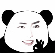 a panda bear is smiling and making an ok sign with his hand .