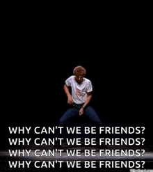 a man is dancing on a stage with a quote that says `` why can 't we be friends '' .