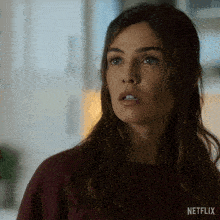 a close up of a woman 's face with the word netflix on the bottom right