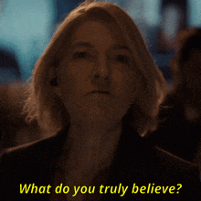 a woman says what do you truly believe in yellow letters