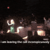 a blurred image of a person on a stage with the words i am leaving the call inconspicuously below them