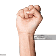 a woman 's fist is raised in the air against a white background