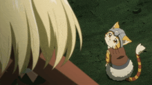 a cat wearing a helmet is looking up at a person