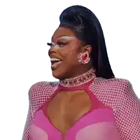 a woman in a pink dress is laughing and wearing earrings
