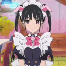 a girl in a maid costume with pig ears and pig ears on her head is smiling .