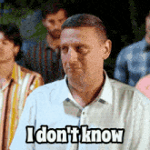a man says i don t know in front of a crowd of people