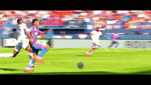 a blurry picture of a soccer game with a sign that says ' equal ' on it