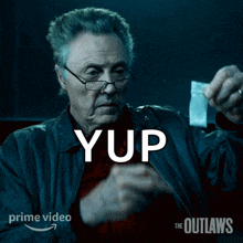 a poster for the outlaws shows a man holding a piece of cocaine in his hand