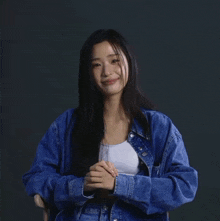 a woman wearing a calvin klein shirt and bra