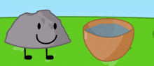 a rock with a smiley face is standing next to a bowl of soup