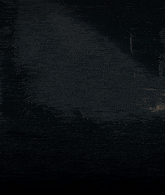a man with a beard is standing in the dark holding a gun