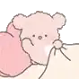 a pink teddy bear is laying under a pink pillow .