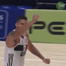 a basketball player with the number 10 on his jersey is celebrating