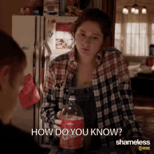 a woman in a plaid shirt is holding a bottle of coca cola and asking how do you know shameless