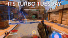 a screenshot of a video game with the words " its turbo tuesday " above it