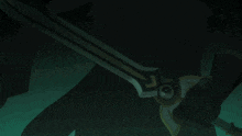 a person is holding a sword that has a blue light on it