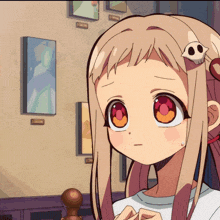 a girl with a skull on her head looks at the camera