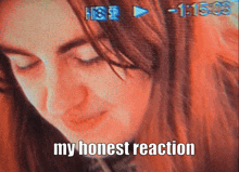 a close up of a woman 's face with the words " my honest reaction " below it