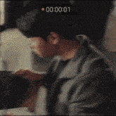 a close up of a person 's face with a timer displaying 00:00