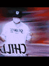 a man wearing a mask and a hat is holding a sign that says chili