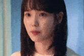 a woman with a tear running down her cheek