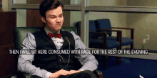 a man in a suit and bow tie sits in a chair with the words then i will sit here consumed