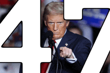 donald trump speaking into a microphone and pointing at the number 47