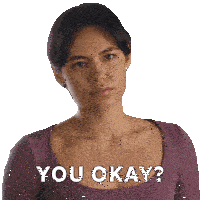 a woman in a purple shirt has the words you okay on her chest
