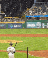 a baseball player with the number 14 on his shirt