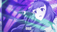 a girl with purple hair is singing into a microphone and the word nut is on the bottom of the screen .