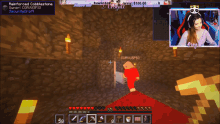 a woman is playing a video game called minecraft with a panda headset on
