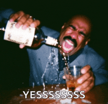 a man is pouring a drink into a glass with the words yessssss written on the bottom