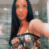 a woman taking a selfie in front of a mirror