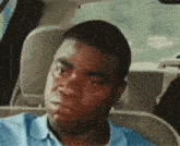 a man is sitting in the back seat of a car