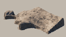 a piece of sand that looks like a piece of concrete