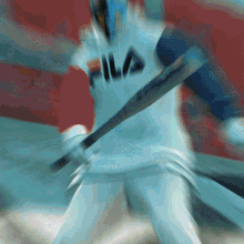a baseball player wearing a fila jersey swings his bat