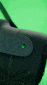 a close up of a virtual reality headset on a green background