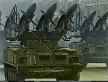 a row of military vehicles with missiles on top