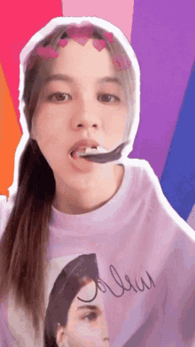 a woman wearing a purple shirt that says ' jolieu ' on it