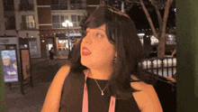 a woman wearing a lanyard that says yeah