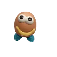 a toy that looks like an egg with big eyes and a yellow smile