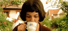 Sipping A Cup Of Coffee Tea GIF