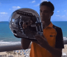 a man holding a disco ball that says monster