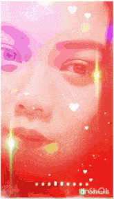 a close up of a woman 's face with hearts on her face and the word christmas in the corner