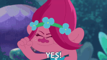a troll with pink hair and blue flowers on her hair
