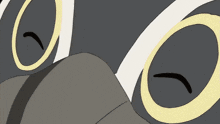 a close up of a cartoon owl 's eyes with a red tongue sticking out